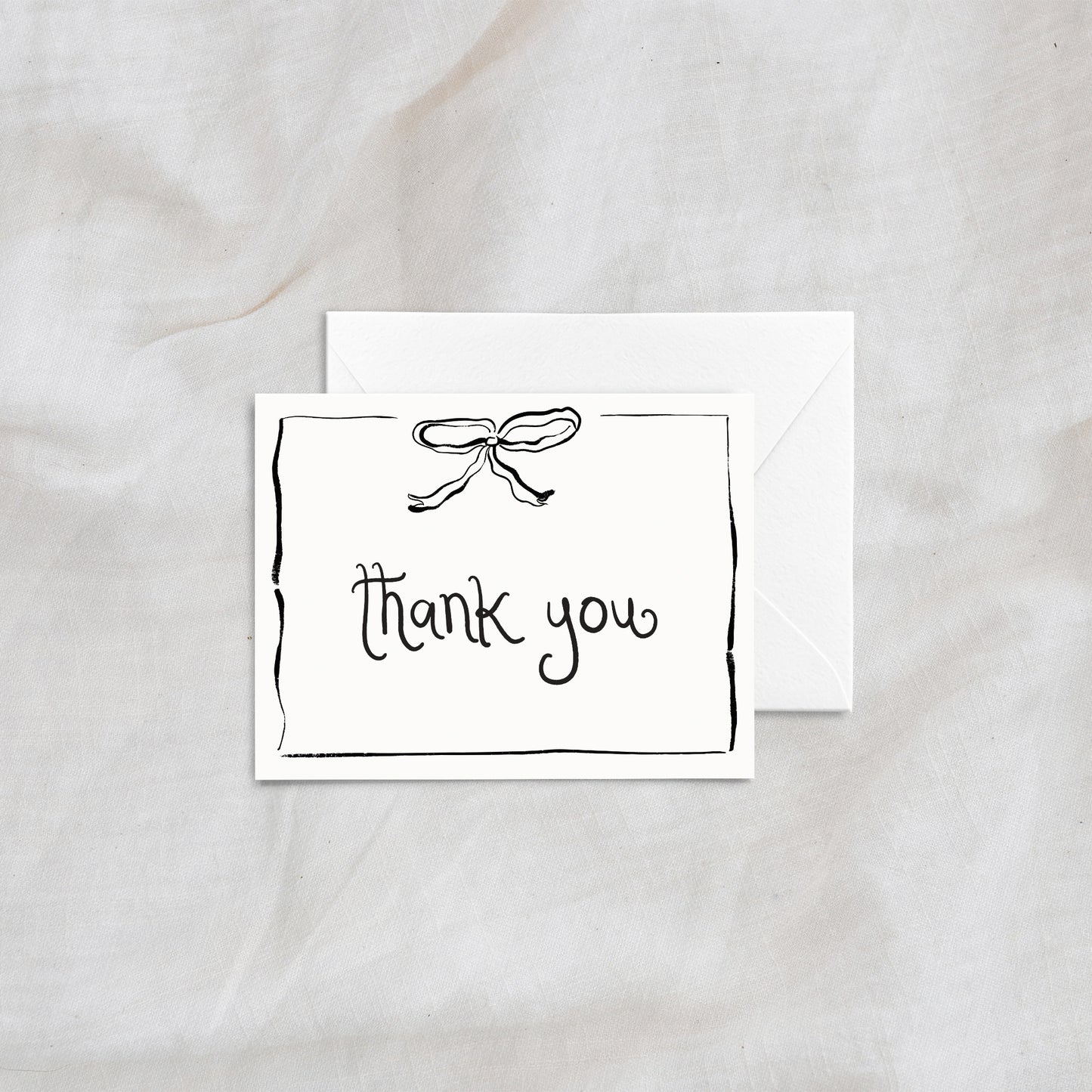A beautifully simple "thank you" card showcasing a hand-drawn ribbon illustration and playful typography. Complete with a matching white envelope, this card is ideal for thank-you notes, gifts, or heartfelt expressions of appreciation.
