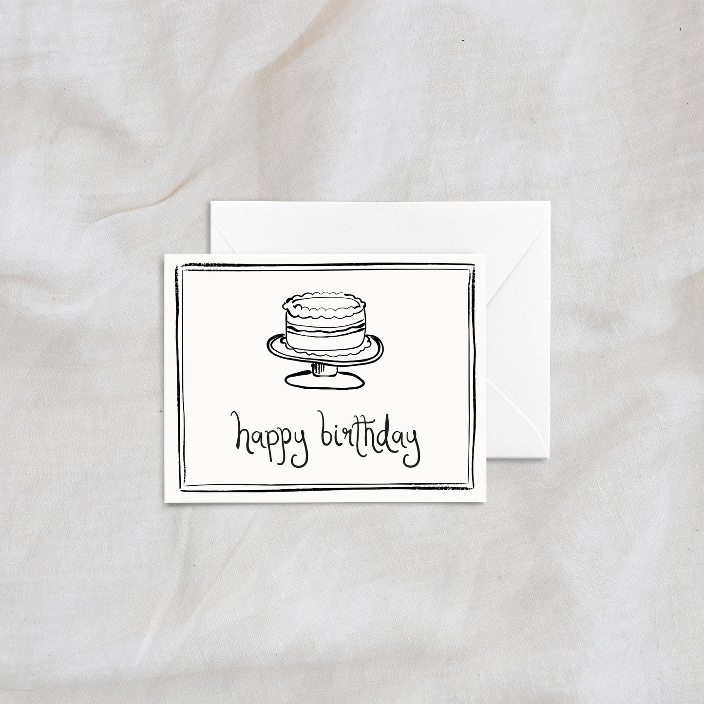 A modern and whimsical "happy birthday" greeting card showcasing a hand-drawn layered cake illustration. Designed with simple black line art and a matching white envelope, ideal for birthdays and special occasions.