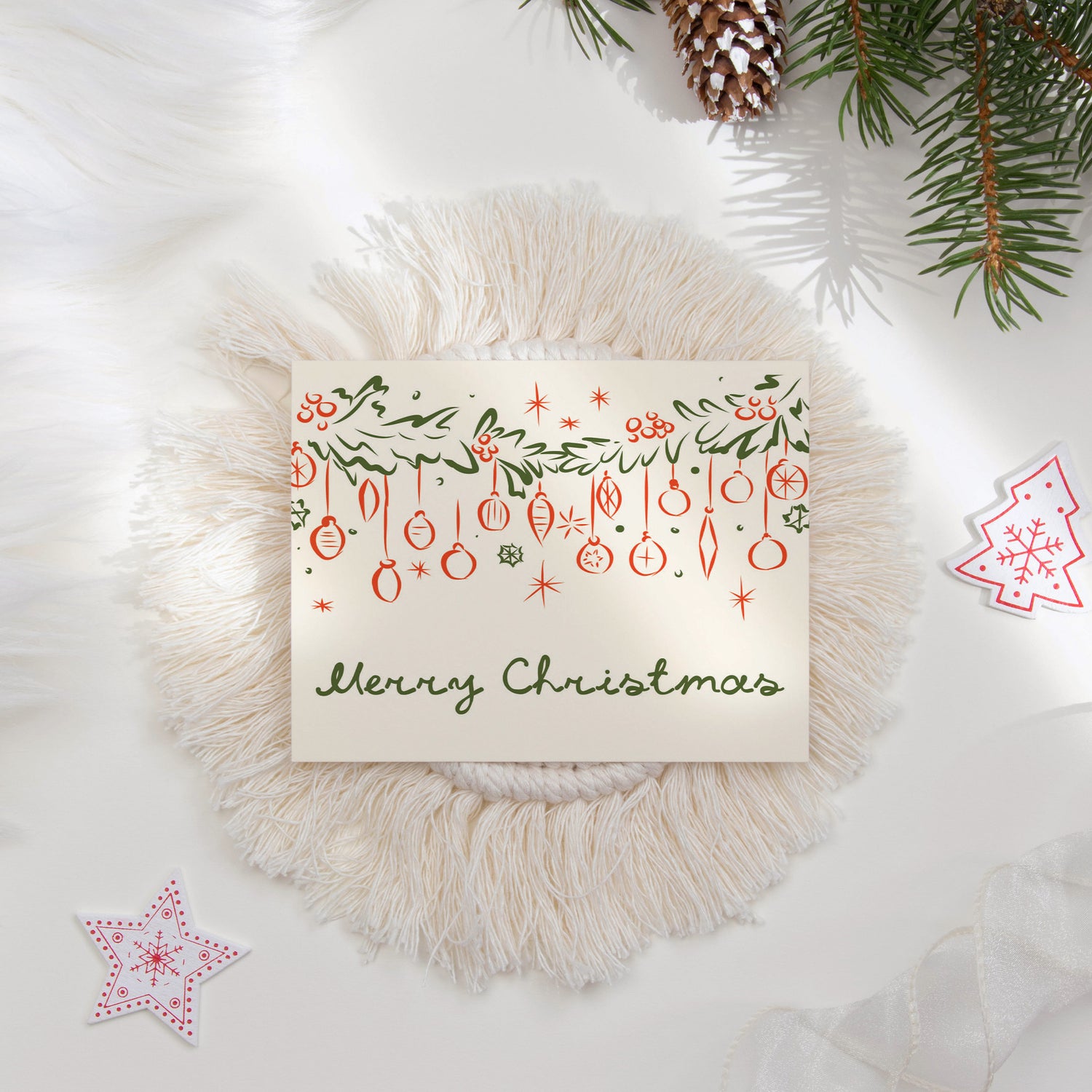 A "Merry Christmas" holiday card with beautifully illustrated garlands, ornaments, and festive accents. Styled with seasonal decor like pine branches and cozy textures, this card is ideal for sending warm wishes during the Christmas season.